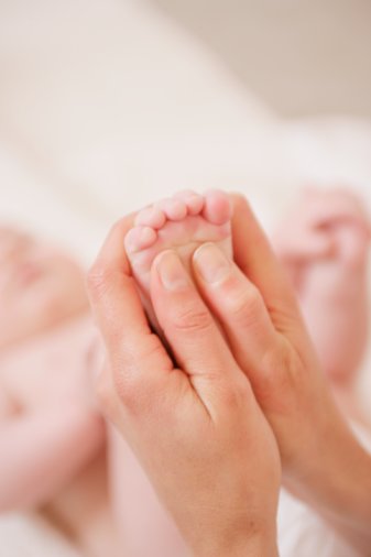 baby feet massage hands massaging